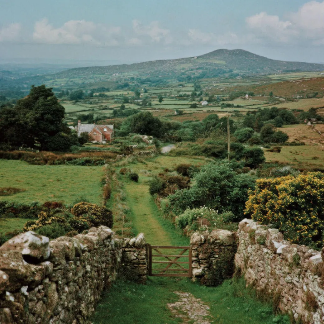 Irish countryside with dry stone walls and a wooden gate